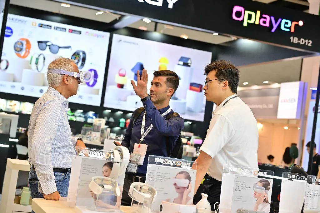 Buyers trying smart glasses and wearables at a booth